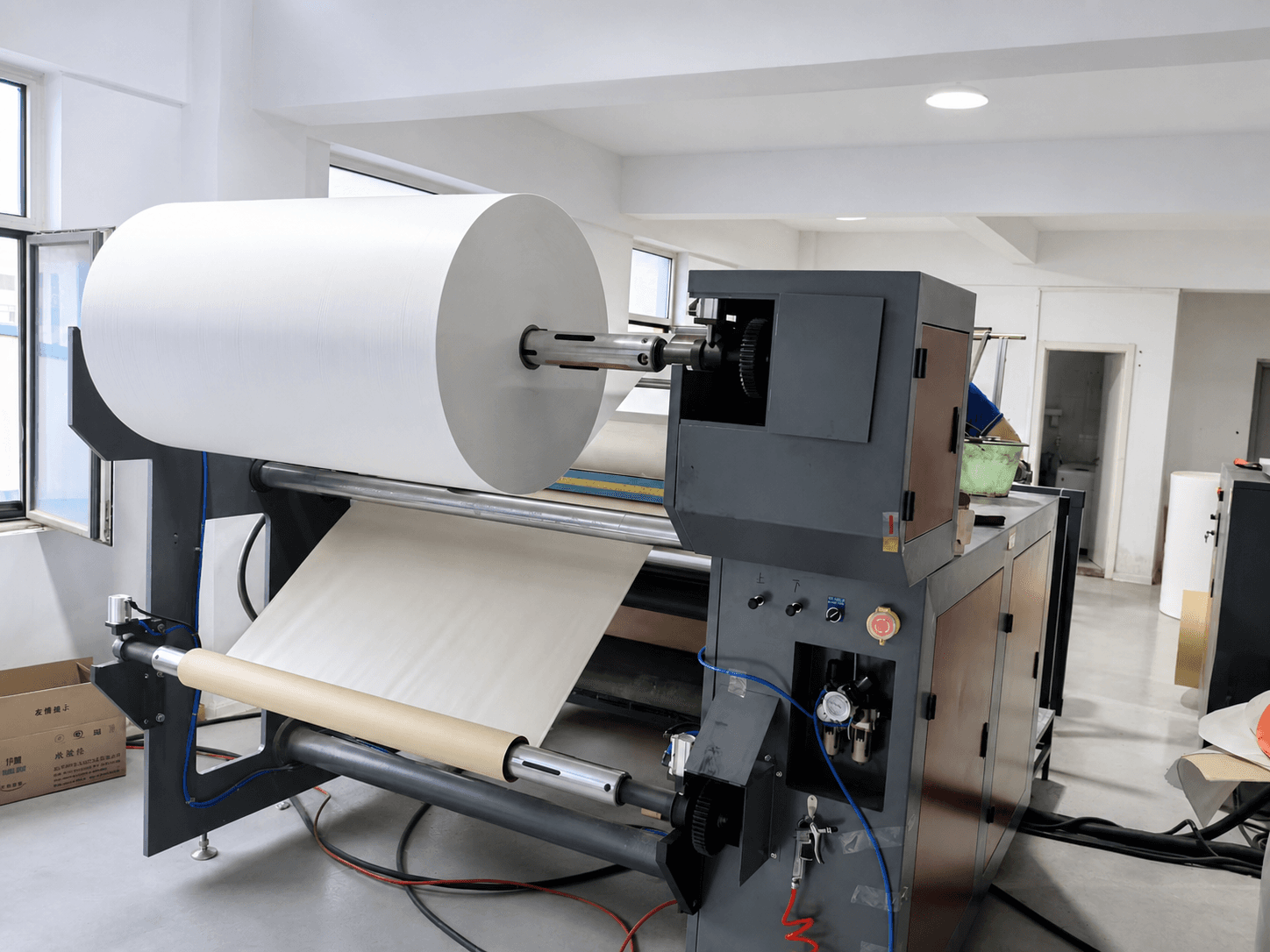 Roll processing machine